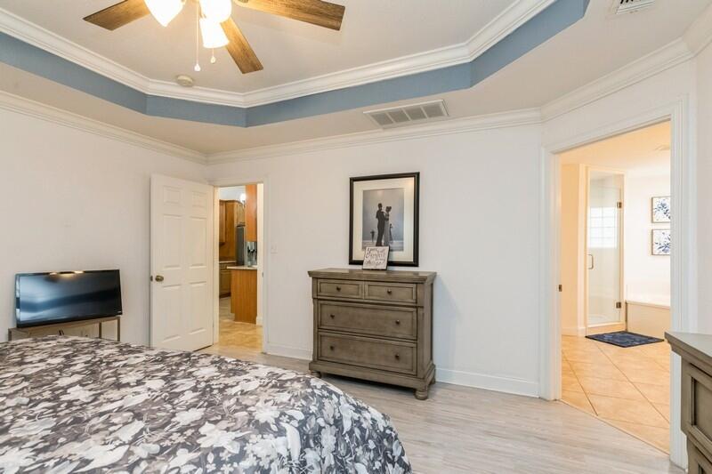 2903 Chancery Lane Crestview, FL 32539 - Photo 28 of 43 a bedroom with a bed and a television