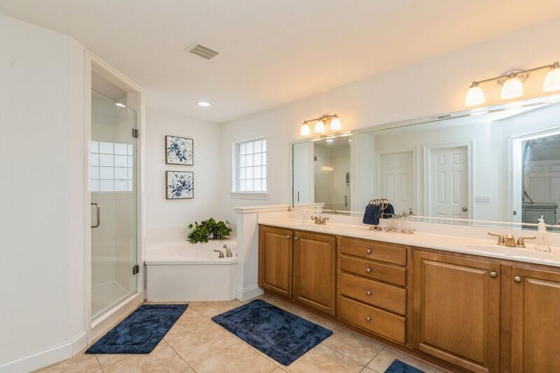 2903 Chancery Lane Crestview, FL 32539 - Photo 29 of 43 a spacious bathroom with a double vanity sink a mirror and a bathtub