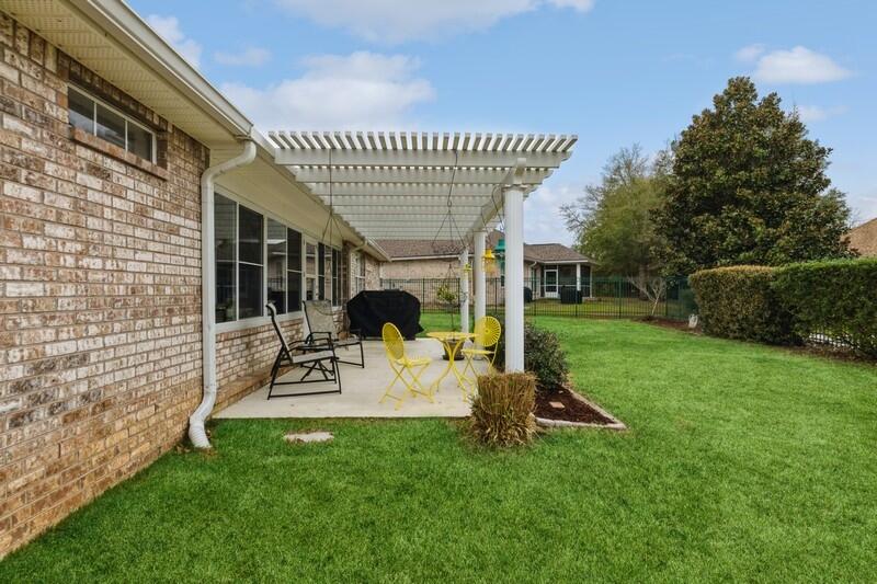 2903 Chancery Lane Crestview, FL 32539 - Photo 34 of 43 a view of a backyard with sitting area and furniture