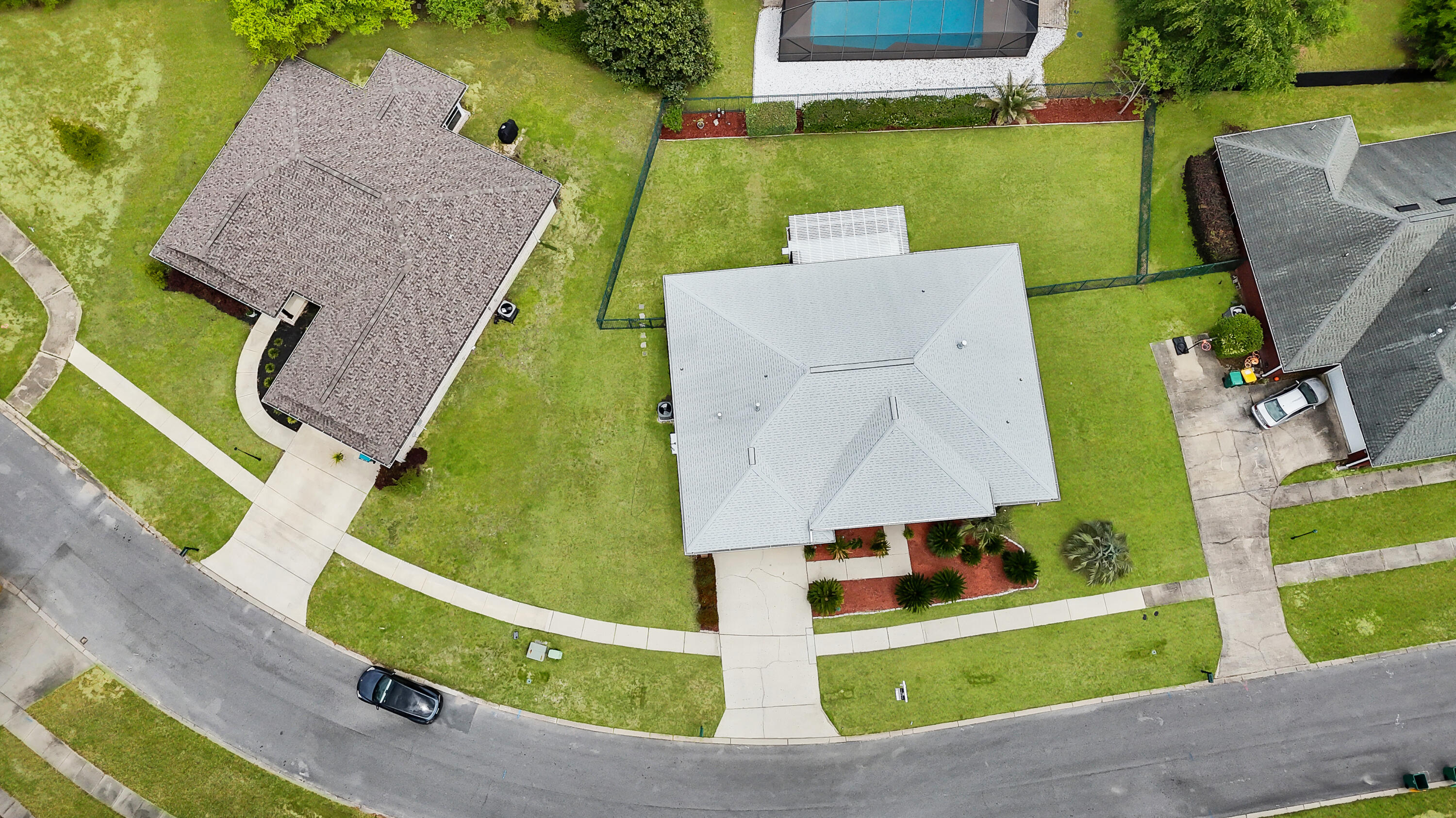 2903 Chancery Lane Crestview, FL 32539 - Photo 39 of 43 an aerial view of a house with a garden and pool