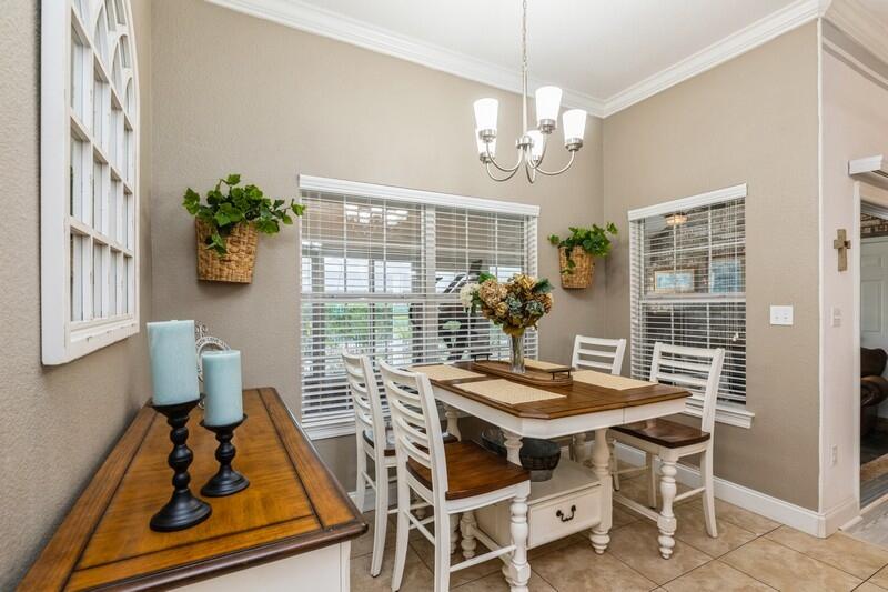2903 Chancery Lane Crestview, FL 32539 - Photo 4 of 43 a view of a dining room with furniture wooden floor and a chandelier