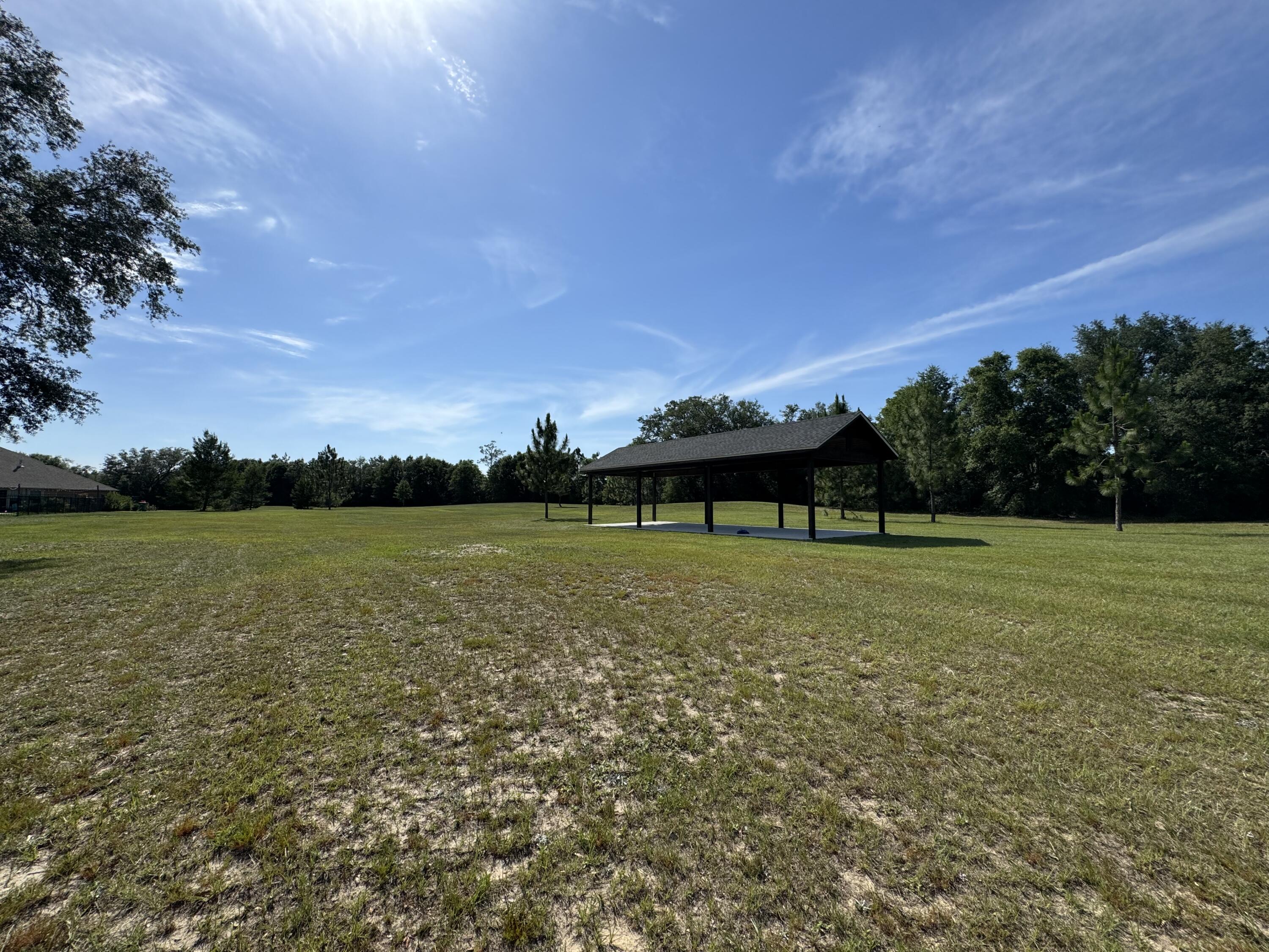 2903 Chancery Lane Crestview, FL 32539 - Photo 42 of 43 a view of a lake with a big yard
