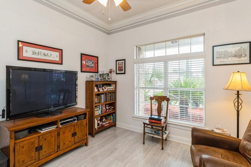 2903 Chancery Lane Crestview, FL 32539 - Photo 6 of 43 a living room with furniture and a flat screen tv