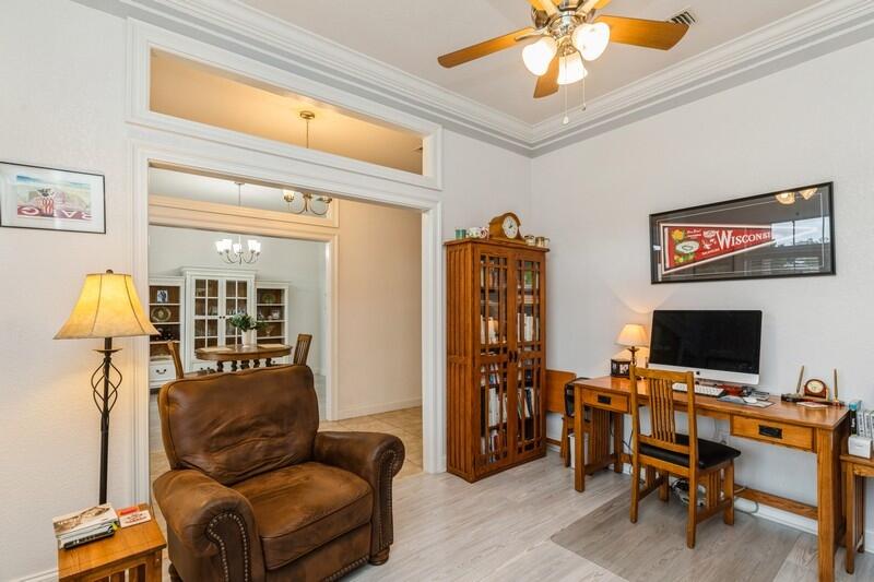 2903 Chancery Lane Crestview, FL 32539 - Photo 8 of 43 a living room with furniture and a flat screen tv