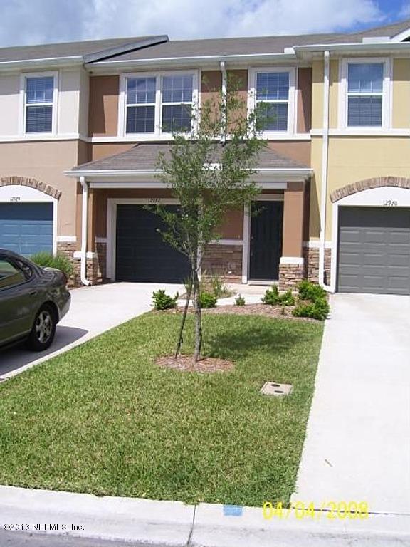 12972 Spring Rain Road Jacksonville, FL 32258 - Photo 1 of 19 a view of a house with a yard and front view of a building