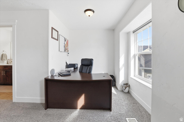 1024 South 270 West Logan, UT 84321 - Photo 21 of 37 Office area featuring light carpet and baseboards