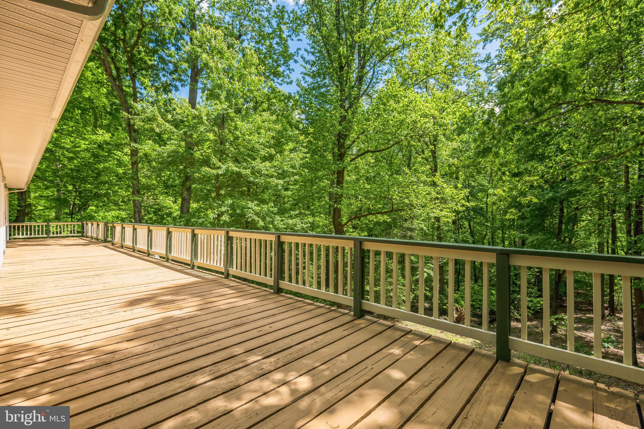 11425 Mill Bridge Road Lusby, MD 20657 - Photo 12 of 40 a balcony with wooden floor and fence