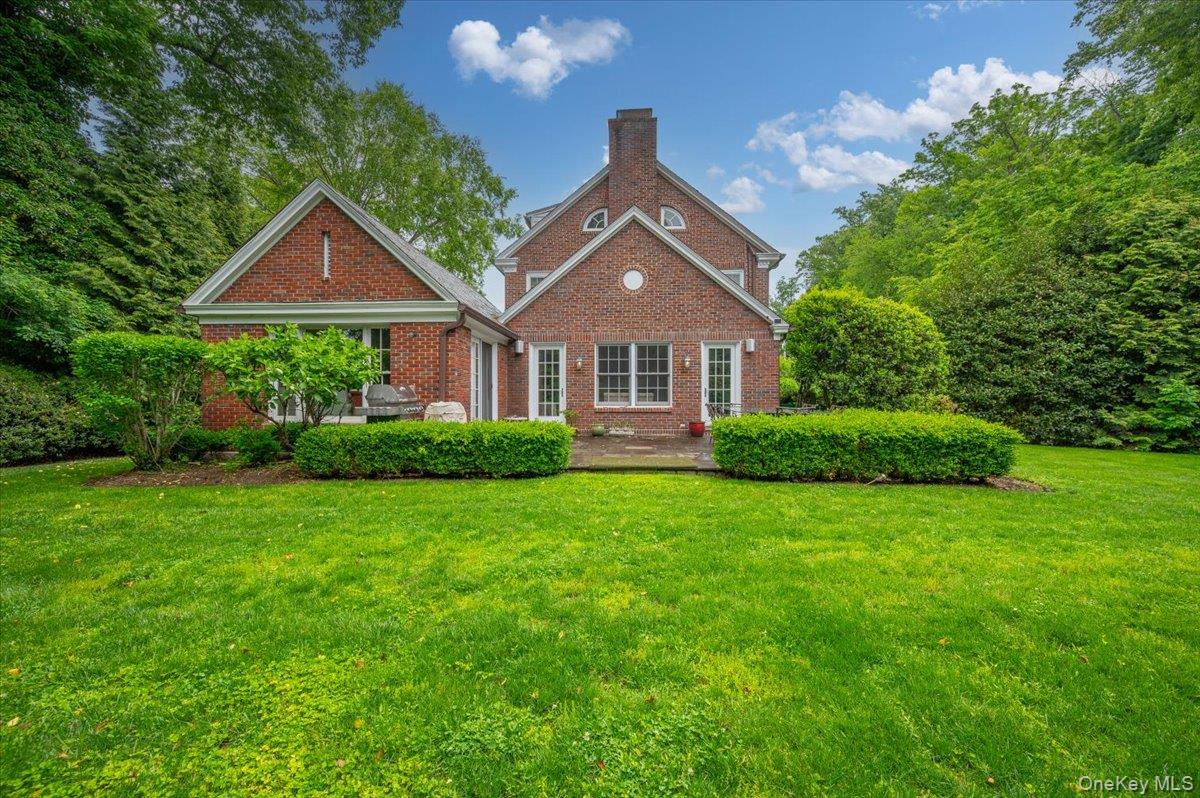 7 Harcourt Road Scarsdale, NY 10583 - Photo 28 of 34 a front view of a house with a yard and trees