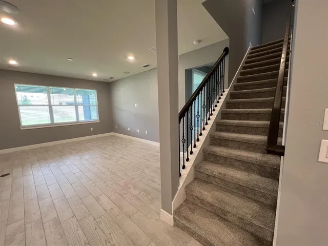 an entryway in a hall with a window
