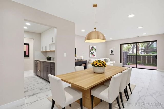 a view of a kitchen with a sink and cabinets