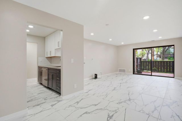 a view of a kitchen with a sink