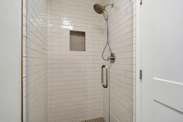 a view of outdoor space with wooden floor and windows