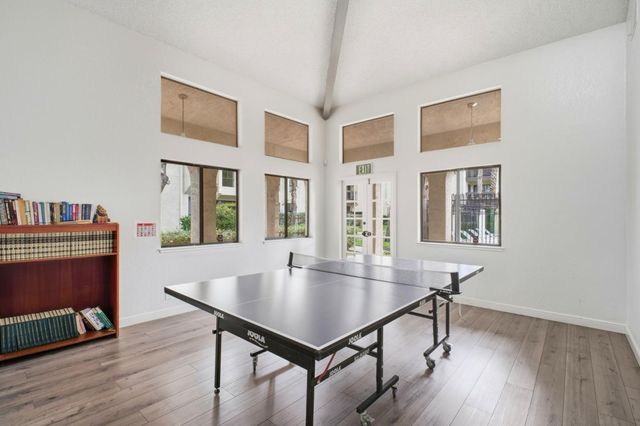 a view of a patio with swimming pool table and chairs