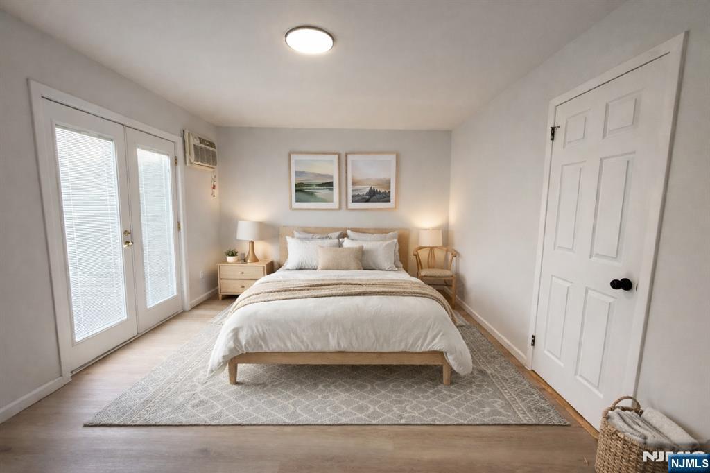 51 Dewitt Street Garfield, NJ 07026 - Photo 8 of 16 a bedroom with a bed and a window