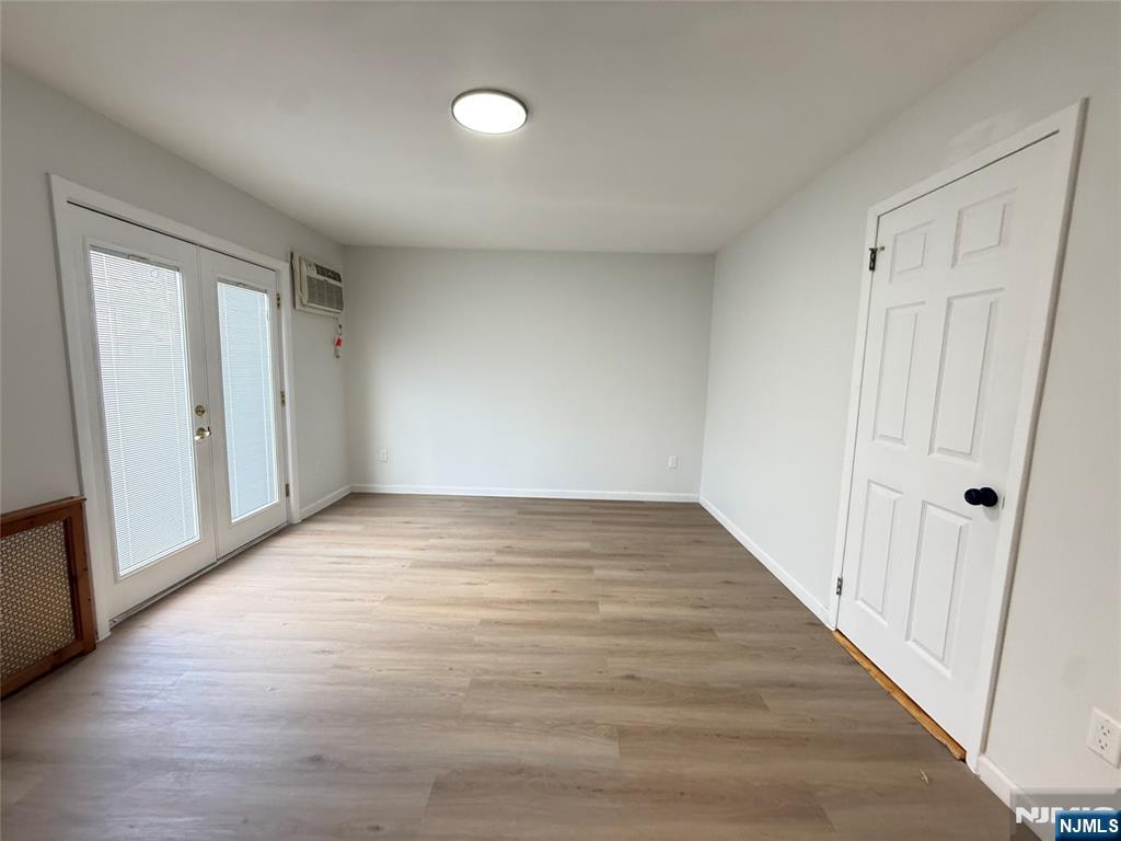 51 Dewitt Street Garfield, NJ 07026 - Photo 9 of 16 a view of an empty room and wooden floor