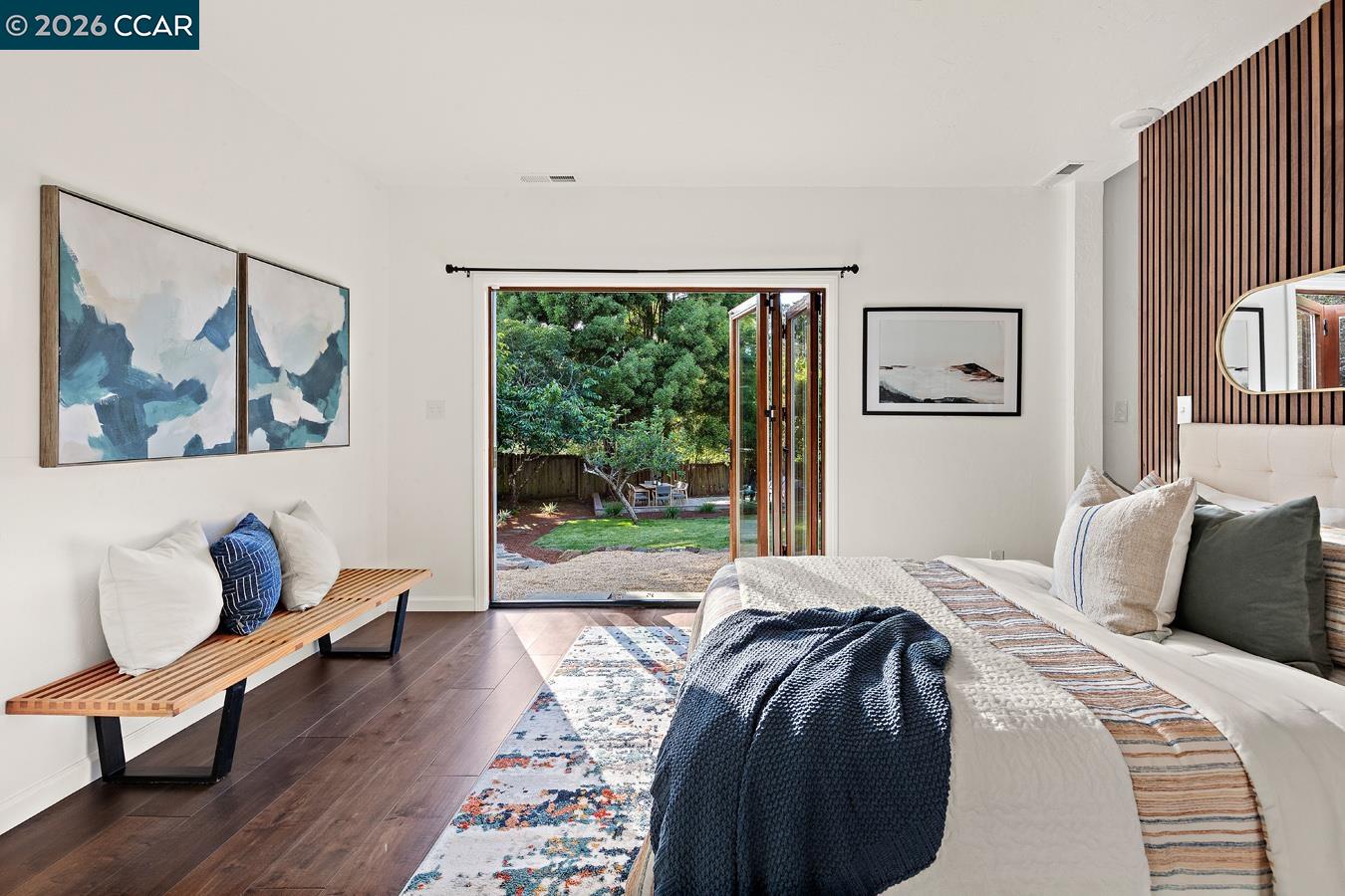85 Ardmore Road Kensington, CA 94707 - Photo 25 of 45 a bedroom with a bed and wooden floor