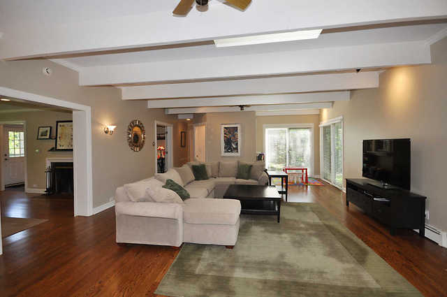 1030 Lee Road Northbrook, IL 60062 - Photo 3 of 16 a living room with furniture and a flat screen tv
