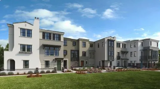 a large building with a yard in front of it