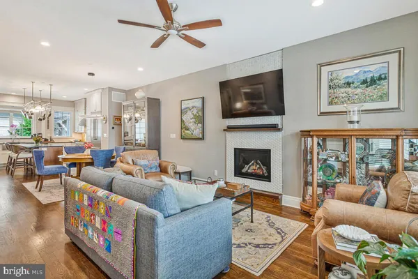 a living room with furniture fireplace and a flat screen tv