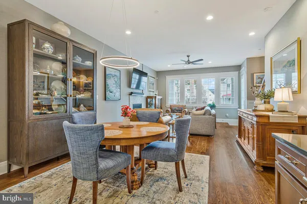 a spacious bathroom with a table and chairs