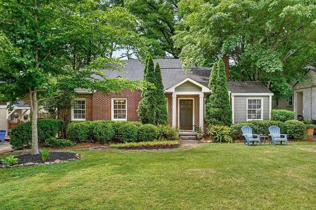 123 Mimosa Place Decatur, GA 30030 - Photo 2 of 48 a front view of a house with a yard and trees