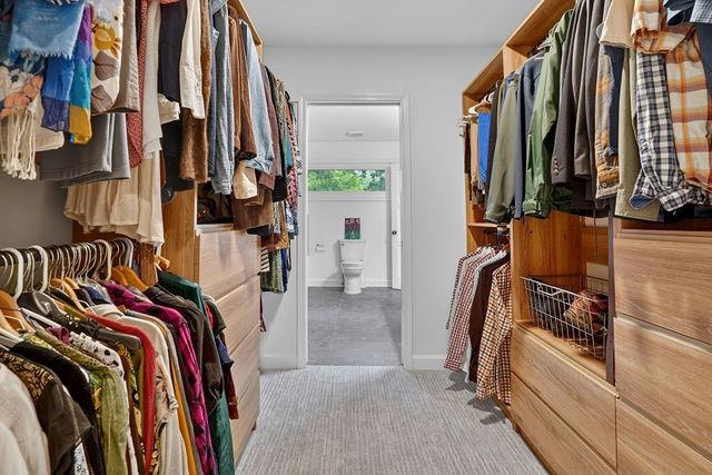 123 Mimosa Place Decatur, GA 30030 - Photo 22 of 48 a view of walk in closet with clothes and shoes