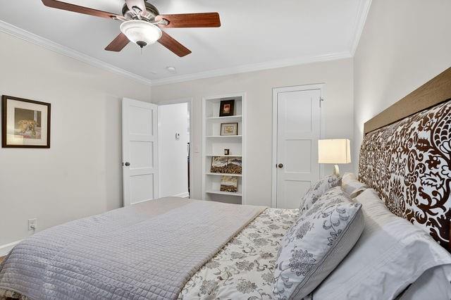 123 Mimosa Place Decatur, GA 30030 - Photo 10 of 48 a bedroom with a bed and a chandelier