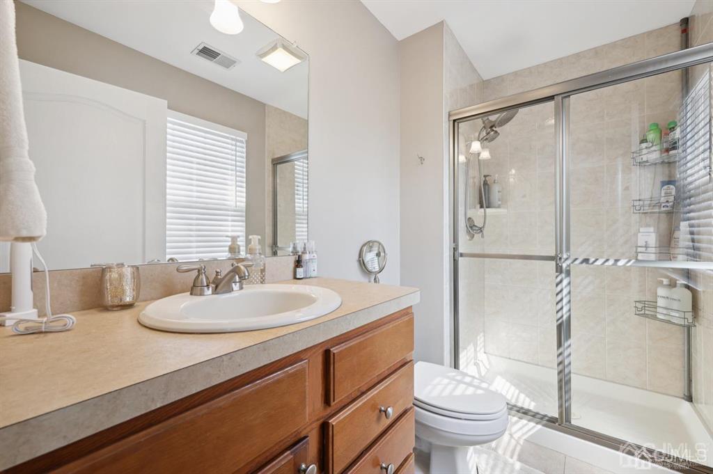 20 Strachan Street Cliffwood, NJ 07721 - Photo 12 of 21 a bathroom with a sink toilet and shower