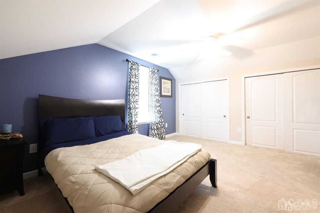 20 Strachan Street Cliffwood, NJ 07721 - Photo 16 of 21 a bed sitting in a spacious bedroom next to a window