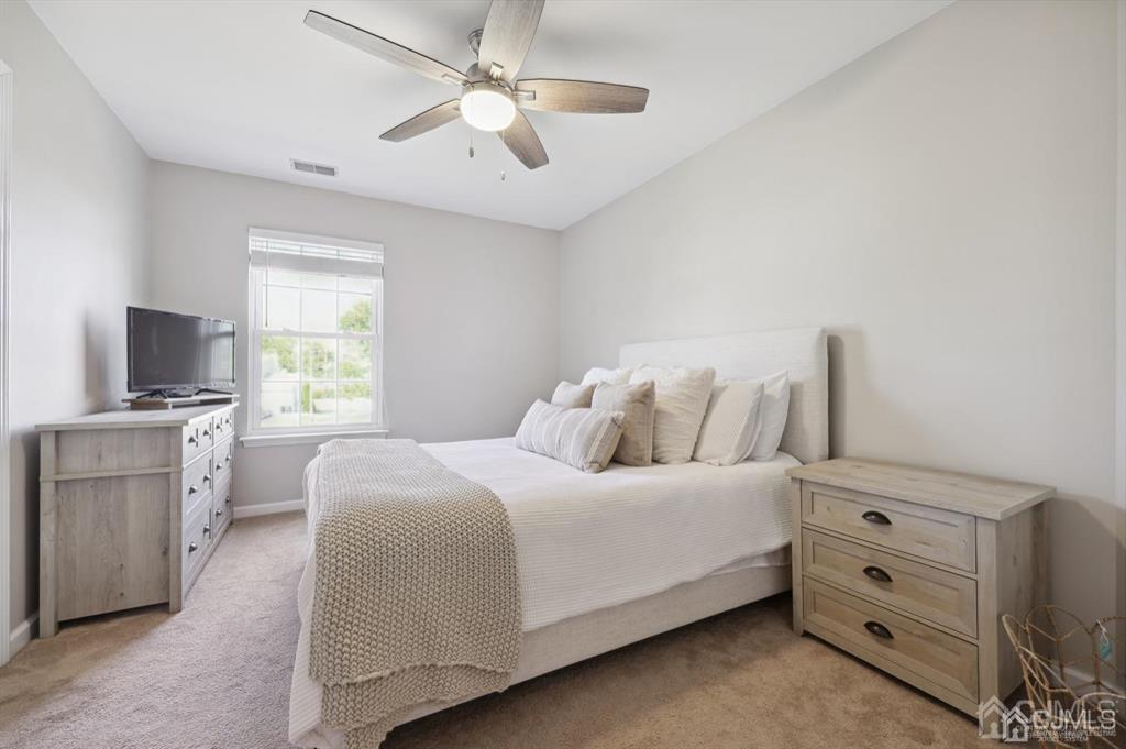 20 Strachan Street Cliffwood, NJ 07721 - Photo 18 of 21 a bedroom with a large bed and a tv