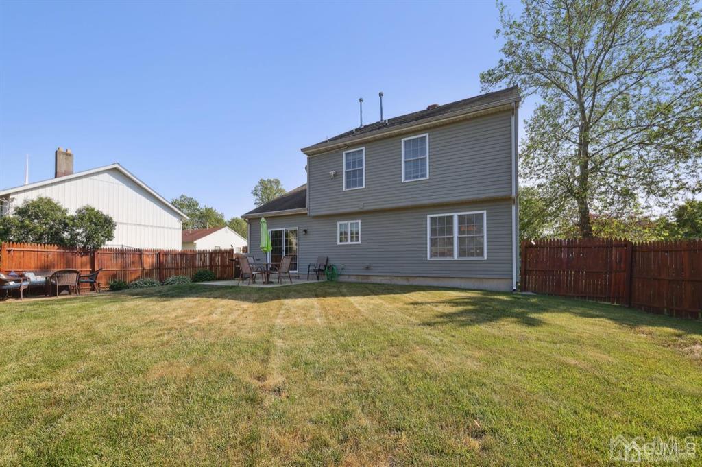 20 Strachan Street Cliffwood, NJ 07721 - Photo 20 of 21 a view of a house with a yard and a house