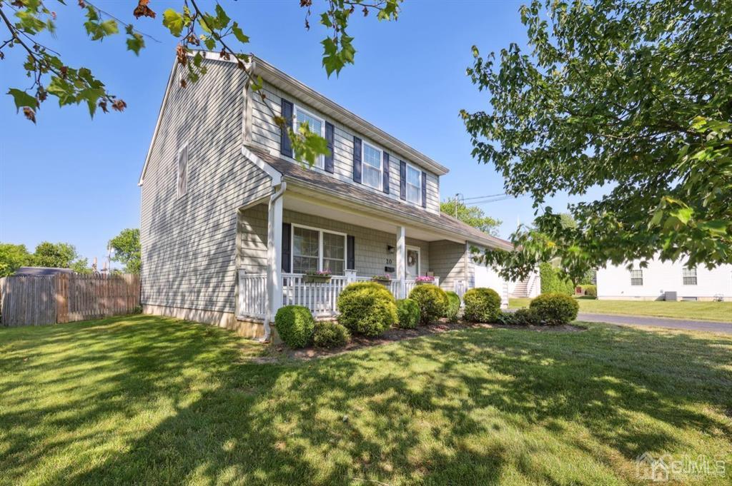20 Strachan Street Cliffwood, NJ 07721 - Photo 2 of 21 a view of a house with a tree in a yard