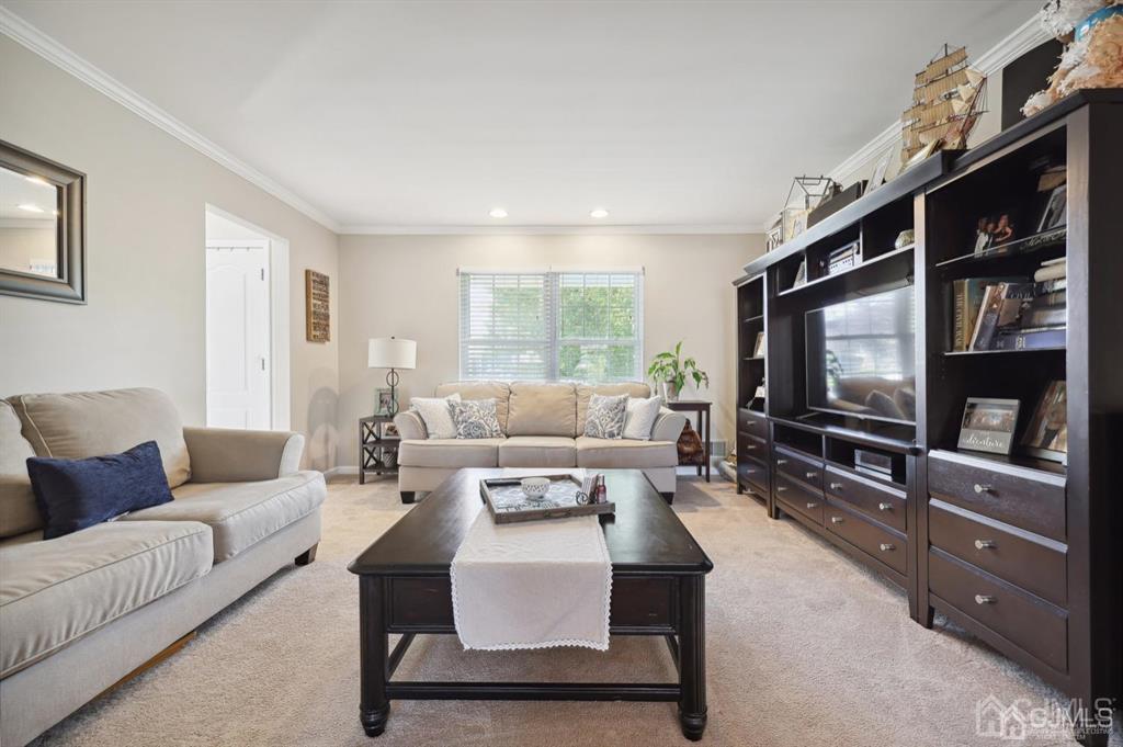20 Strachan Street Cliffwood, NJ 07721 - Photo 3 of 21 a living room with furniture and a flat screen tv