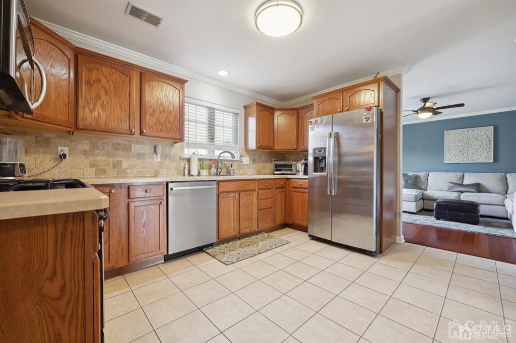 20 Strachan Street Cliffwood, NJ 07721 - Photo 6 of 21 a kitchen with stainless steel appliances granite countertop a refrigerator sink and cabinets