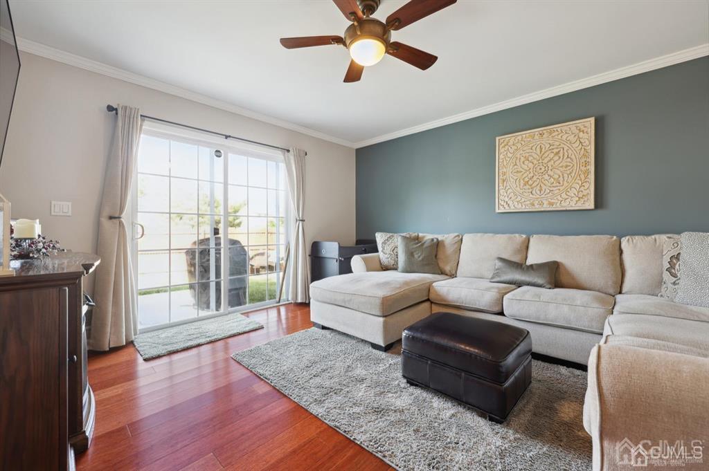 20 Strachan Street Cliffwood, NJ 07721 - Photo 8 of 21 a living room with furniture and a window