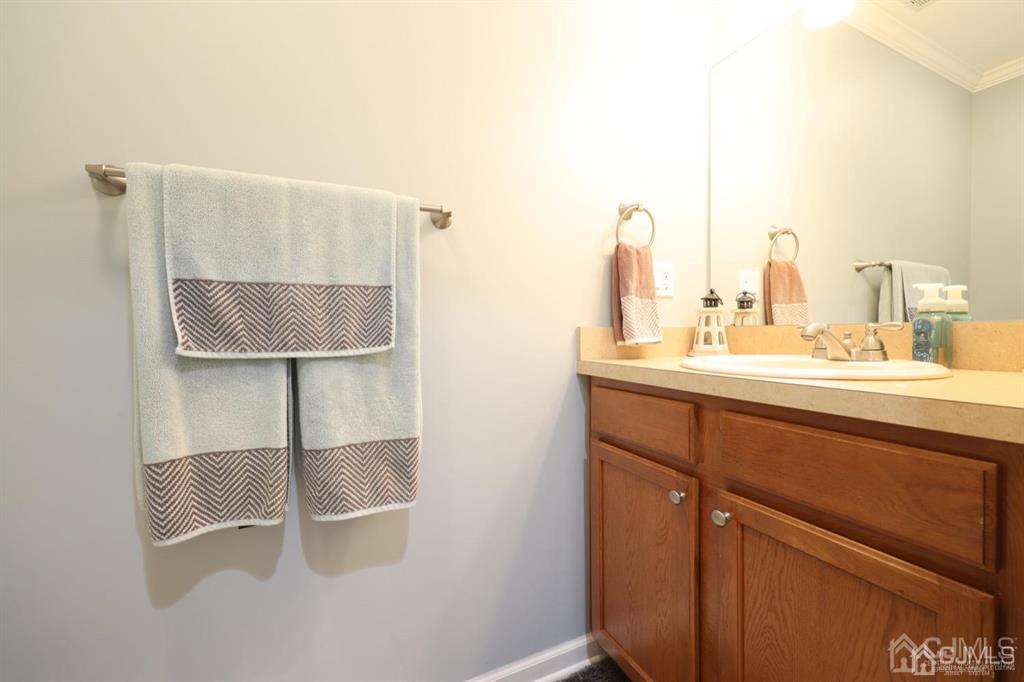 20 Strachan Street Cliffwood, NJ 07721 - Photo 9 of 21 a bathroom with a sink and a mirror