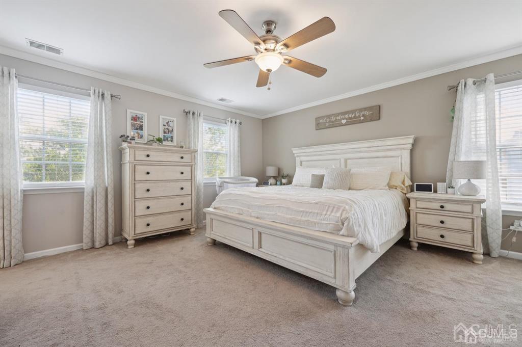 20 Strachan Street Cliffwood, NJ 07721 - Photo 10 of 21 a bedroom with a bed and a ceiling fan