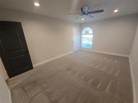 19103 Whitewood Drive Spring, TX 77373 - Photo 17 of 30 an empty room with windows and fan