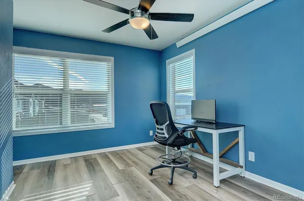 a workspace with furniture and a window