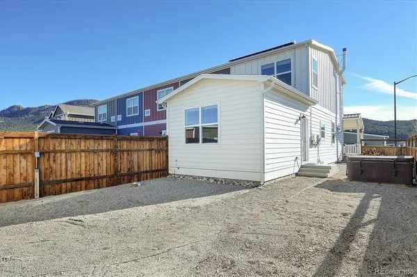 a view of a house with a backyard