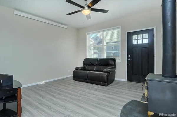 a living room with furniture and a window