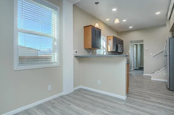 a view of kitchen with wooden floor