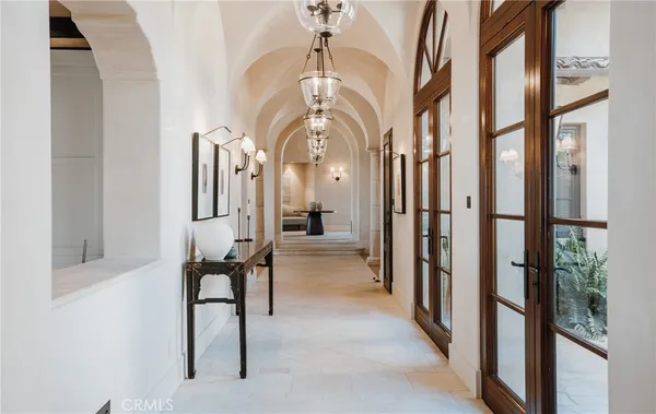 a large kitchen with stainless steel appliances kitchen island granite countertop a refrigerator and a stove top oven