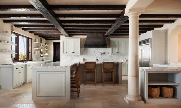 a living room with furniture a ceiling fan and a rug