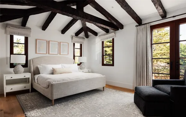 a bedroom with a large bed and a couch