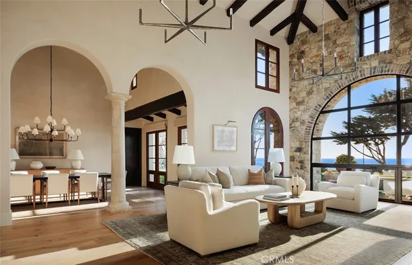 a living room with furniture and a lamp