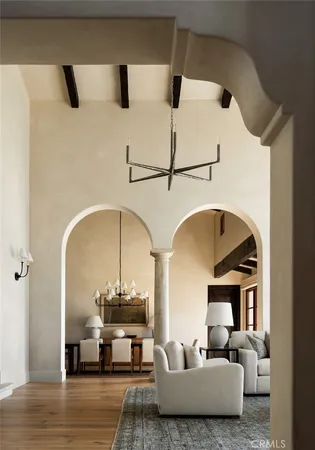 a view of a dining room with furniture and chandelier