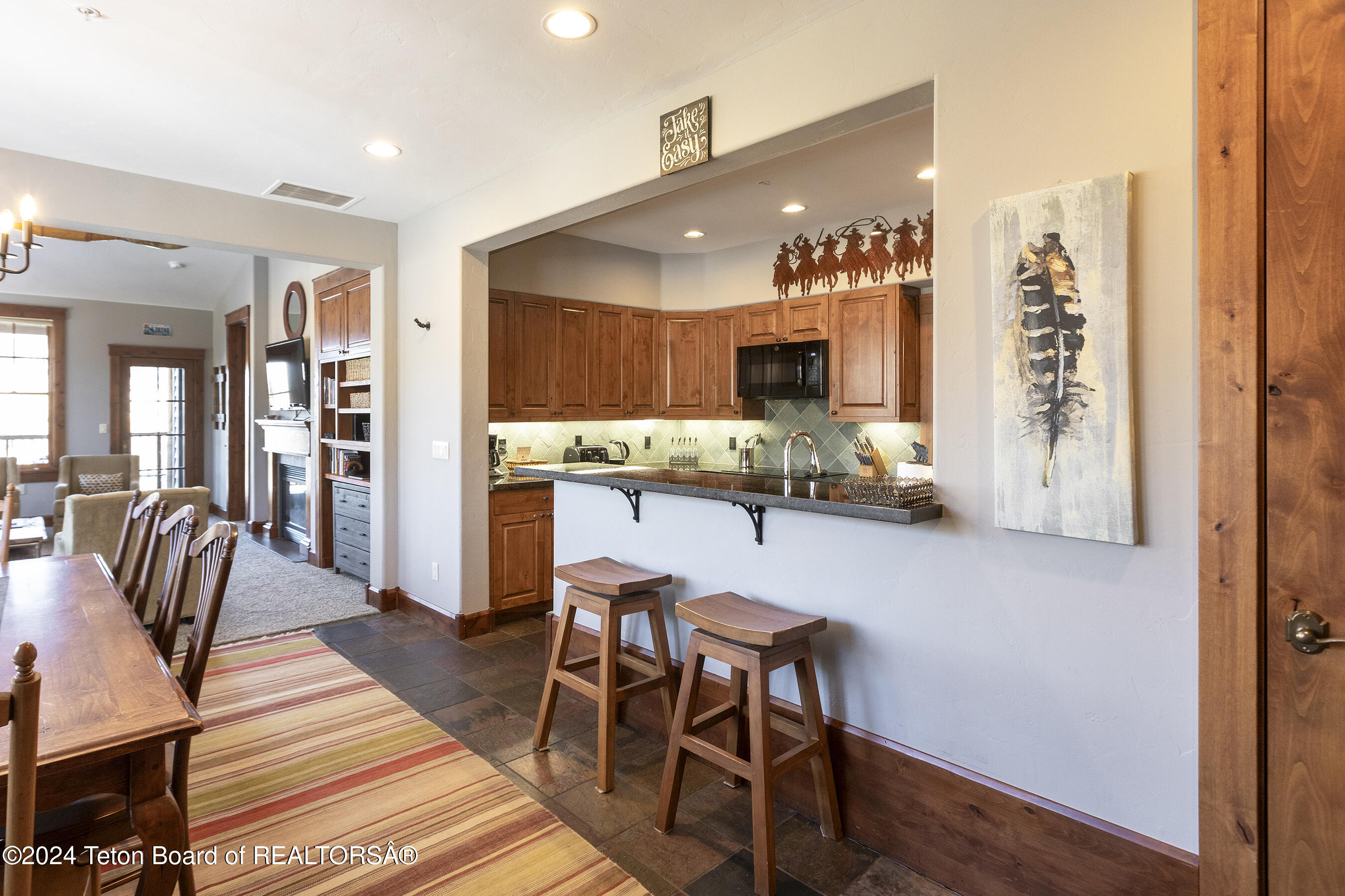 531 Snow King Loop, Unit 3130 Jackson, WY 83001 - Photo 6 of 21 Kitchen Bar to Living_email