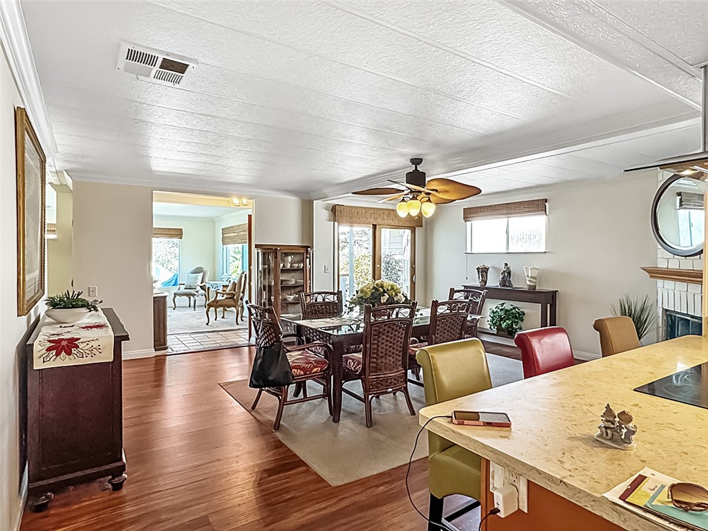26 Mira Las Olas San Clemente, CA 92673 - Photo 12 of 34 a living room with furniture a dining table and a large window