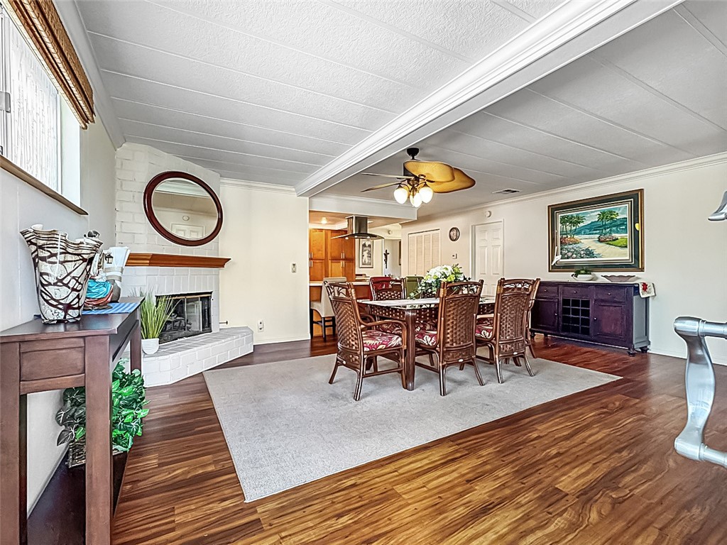 26 Mira Las Olas San Clemente, CA 92673 - Photo 14 of 34 a dining room with fireplace furniture and a rug